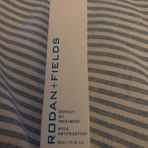 Rodan + Fields Defrizz+ Oil Treatment in Blue and White